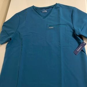 Brand new tag on M one pocket Jaanuu Caribbean blue scrub top